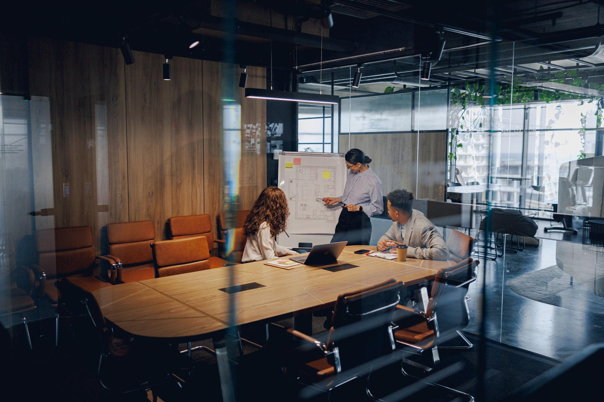 On Cue Hire team meeting in a modern conference room